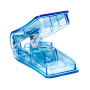 Blue plastic pill cutter on a white background