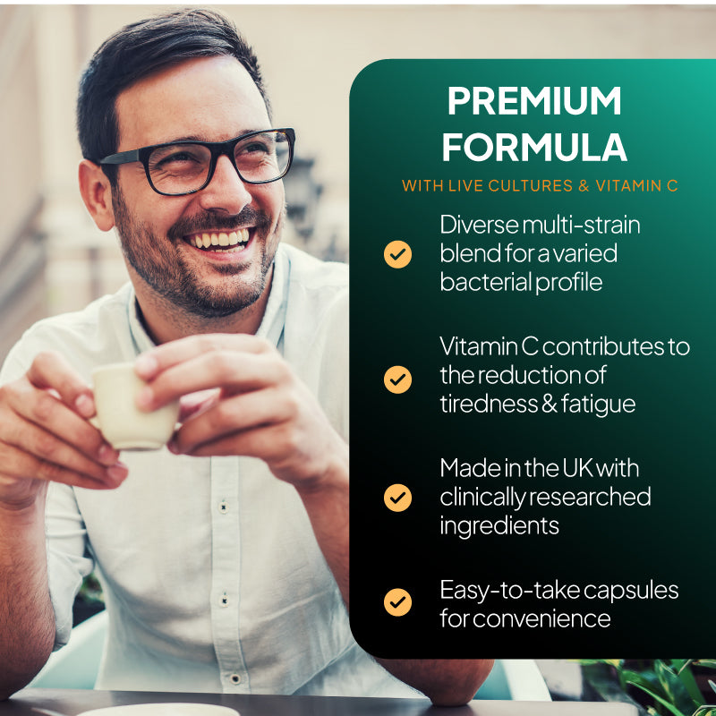 Premium formula supplement benefits image showing a smiling man drinking coffee alongside claims about live cultures, vitamin C, reduced tiredness and fatigue, UK-made clinically researched ingredients, and easy-to-take capsules
